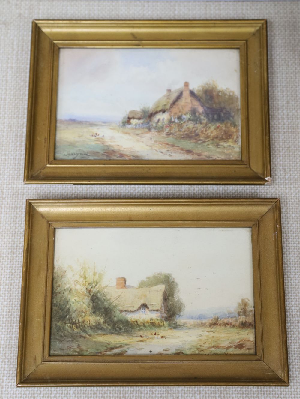 L. Goodwin, pair of watercolours, Landscapes with thatched cottages, one signed, 12 x 18cm